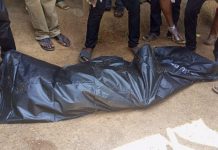 Mankessim: Woman nearly lynched after being caught burying dead husband secretly
