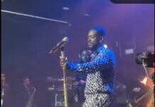Adekunle Gold moved to tears on stage after emotional message from wife, daughter