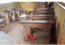 Education in Crisis: 6 pupils at Odumasi R/C basic school sit on one dual desk