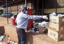 Medical Superintendent of Tamale Central Hospital rolls up his sleeves to clean waste resulting from casual workers’ strike