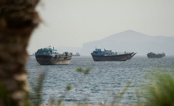 FILE PHOTO: Vessels carrying Middle East oil, LNG exit Hormuz, head for Pakistan, China